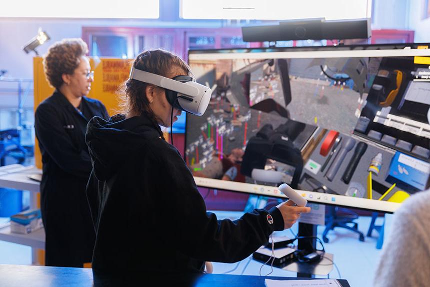 A student using virtual reality in a forensic science class